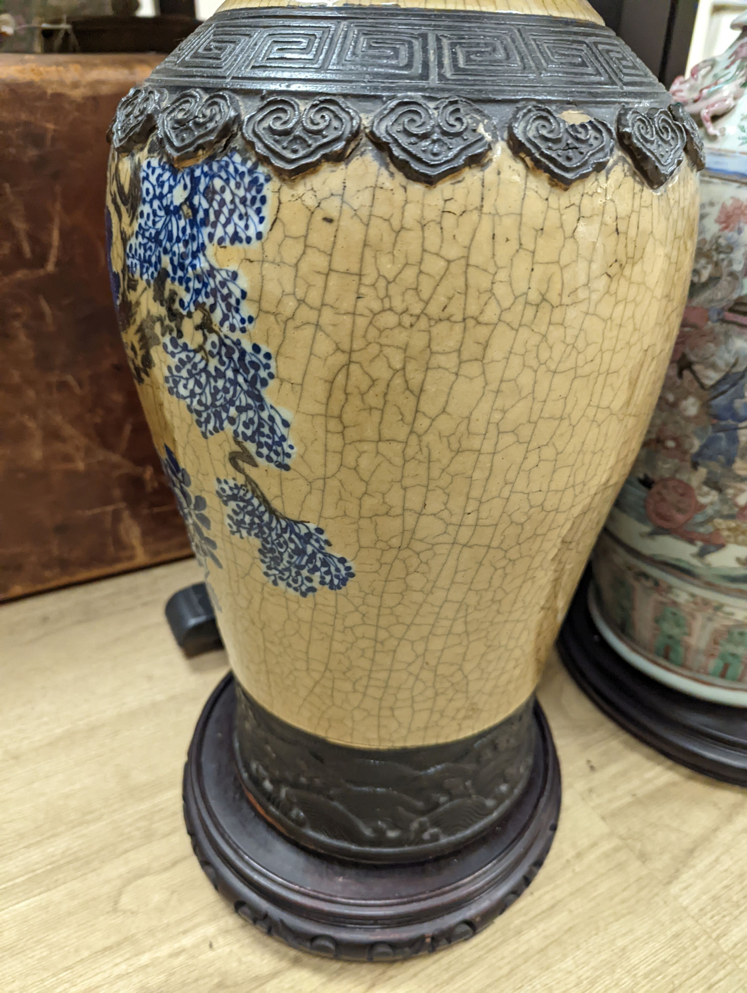 A large Chinese crackle glaze vase, late 19th/early 20th century and a large Chinese famille rose vase, late 19th century, tallest 60 cm.